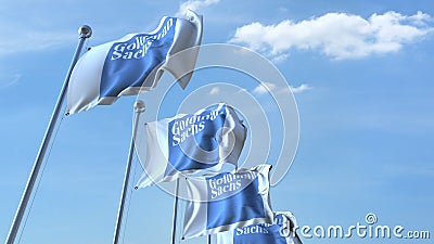 Waving flags with Goldman Sachs logo against sky, editorial 3D rendering Editorial Stock Photo