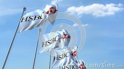 Waving flags with HSBC logo against sky, editorial 3D rendering Editorial Stock Photo