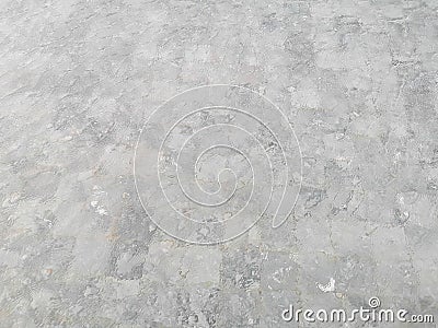 Waving pattern of vivid turquoise blue water in the swimming pool above stone tiles with soft light of reflection of the sunshine Stock Photo