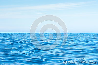 Wavy blue ocean with blue sky Stock Photo