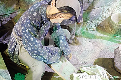 Wax figure of woman washing clothes, adobe rgb Editorial Stock Photo