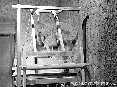 Wax figure of woman weaving, black and white image Editorial Stock Photo