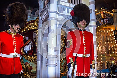 Wax figures of Royal Guards at Madame Tussauds museum in London. British Guards in red uniform are the sign of London. Editorial Stock Photo