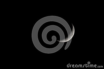 Waxing Crescent Moon Phase isolated on black Stock Photo