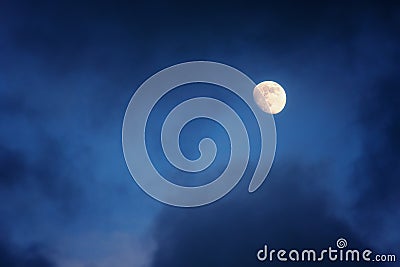 Waxing gibbous moon on cloudy sky Stock Photo