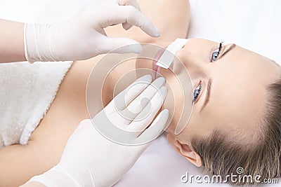 Waxing woman leg. Sugar hair removal. laser service epilation. Salon wax beautician procedure Stock Photo