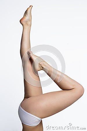 Waxing woman smooth legs pointing up Stock Photo