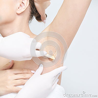Waxing woman body. Sugar hair removal. laser service epilation. Salon wax beautician procedure Stock Photo