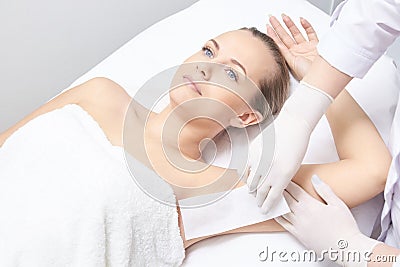 Waxing woman leg. Sugar hair removal. laser service epilation. Salon wax beautician procedure Stock Photo