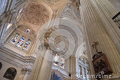 Way of the cross, pillar, vaults and stained glass windows in Malaga Cathedral Editorial Stock Photo