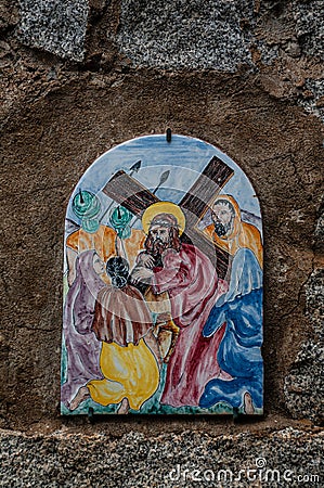 Way of the cross. 8th Station. Jesus comforts the women of Jerusalem. Hand painted ceramic tile, Ingurtosu, Arbus, South Sardinia Editorial Stock Photo