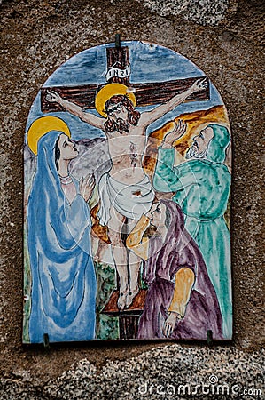 Way of the cross. 12th Station. Jesus dies on the cross. Hand painted ceramic tile, Ingurtosu, Arbus, South Sardinia Editorial Stock Photo