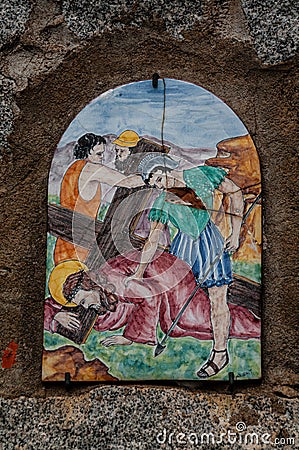 Way of the cross. 7th Station. Jesus falls for the second time. Hand painted ceramic tile, Ingurtosu, Arbus, South Sardinia Editorial Stock Photo