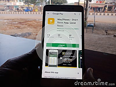 Way2news latest local news online android app displayed on smart phone screen holded hand mobile concept in India dec 2019 Editorial Stock Photo