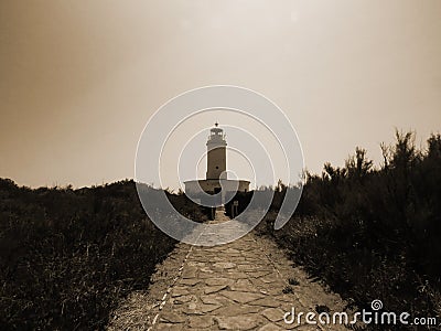 Way to the lighthouse. sepia tone postcard Stock Photo