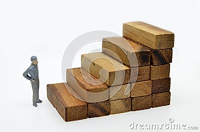 Way to success with businessman and wood block step Stock Photo