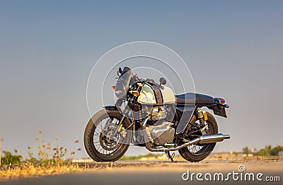 On the way to a summer vacation, riding a motorcycle down an empty road on a tour route. Explore the natural wonders of the world Stock Photo