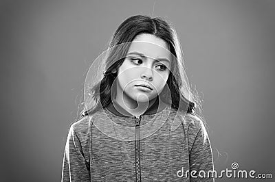 Ways parents can change kids likes and dislikes. Girl little kid sad face dislike something. Kid unhappy small baby Stock Photo