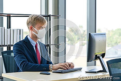 Ways to prevent the transmission of disease can be done by wearing a surgical mask Stock Photo
