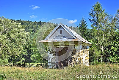 Wayside old stone chapel Stock Photo