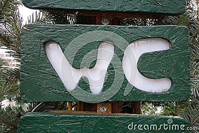 wc banner pointing where the water close is Stock Photo