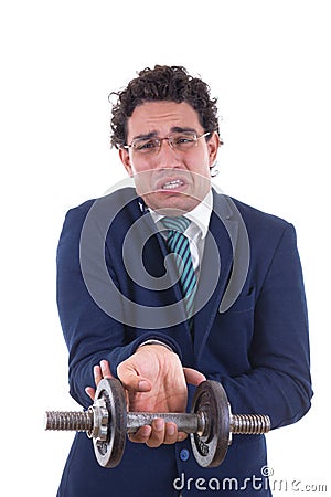 Weak man in suit lifting a weight Stock Photo