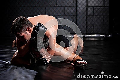 Weak MMA fighter about to tap out Stock Photo