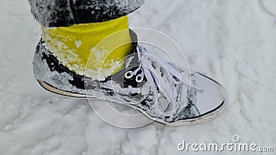 Wearing chucks in deep snow with yellow socks iced up! Stock Photo