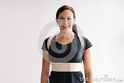 Wearing Posture Corrector Belt Or Physio Decompression Back Belt Stock Photo