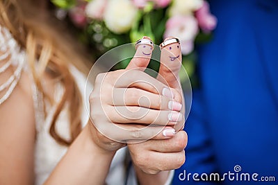 Wearing rings on his fingers which painted smiles Stock Photo