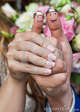 Wearing rings on his fingers which painted smiles Stock Photo