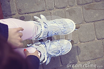 She wears roller skates. Stock Photo