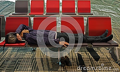 Weary traveller napping due to jet lag Editorial Stock Photo