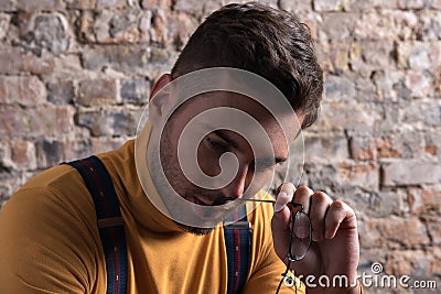 Weary youthful guy expressing sadness Stock Photo