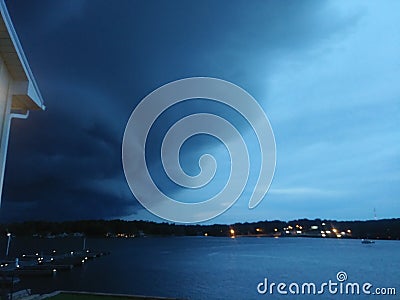 Weather changing over lake as Stock Photo