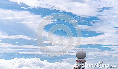 Weather observations radar dome station against blue sky and white fluffy clouds. Aeronautical meteorological observations station Stock Photo