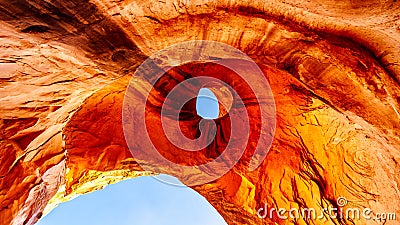 The weather stained ceiling the Big Hogan arch in Monument Valley. It is shaped like an Eagle`s Head with the hole forming the eye Stock Photo