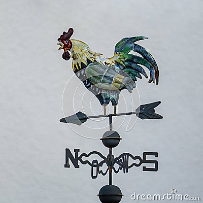 Weather vane with colored rooster Stock Photo