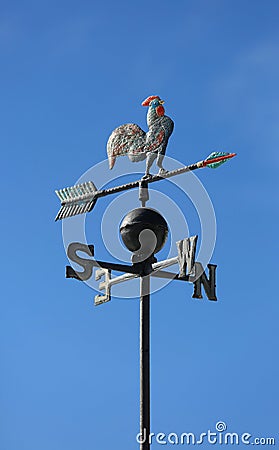 Weather vane to indicate the wind direction with a rooster in wr Stock Photo
