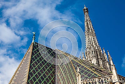 The weathercock and roof of the beautiful antique Saint Stephen Cathedral built on 1160 located at Stephansplatz in Vienna Stock Photo