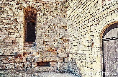 Weathered ancient Rhodes fortress stone brick wall Stock Photo