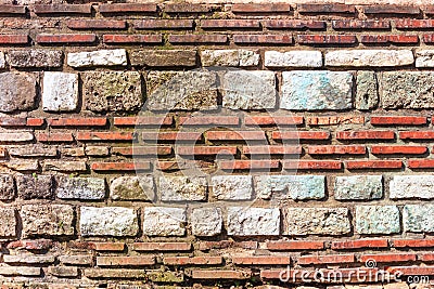 Weathered antique wall, ancient roman brick masonry, horizontal grunge background Stock Photo