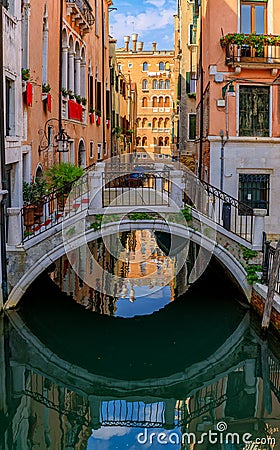Weathered building facade on a picturesque canal in Venice Italy Stock Photo