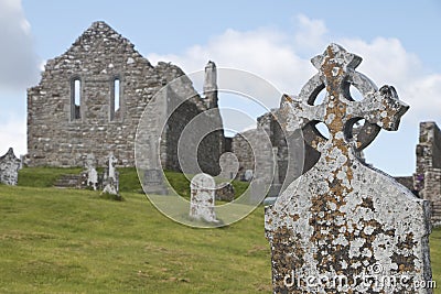 Weathered Celtic Cross at Clonmacnoise monastic site Stock Photo