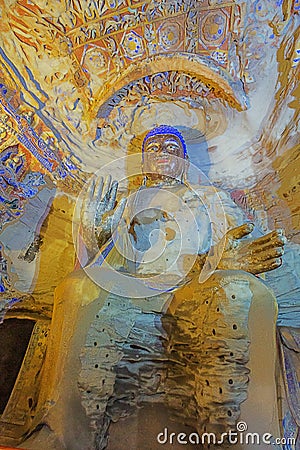 Weathered colorful Buddha statue in cave 9 of the Yungang Grottoes Stock Photo