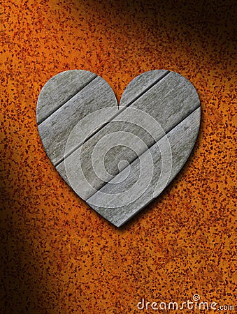 Weathered gray wood heart against rusty metal background Stock Photo