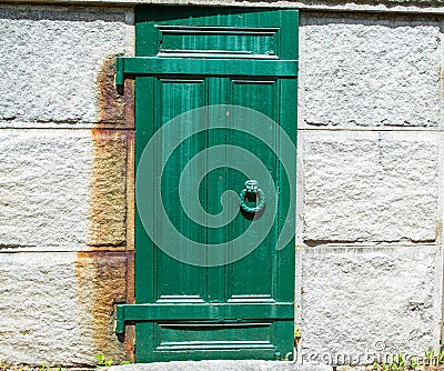 Weathered door to cemetery crypt Stock Photo