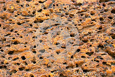 Weathered grungy sandstone surface. Rough texture of natural stone. Porous stone closeup. Ancient rustic surface Stock Photo