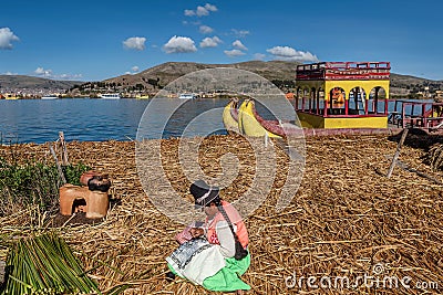 Weathered reed boats along the coast of Lake Titicaca in Puno, P Editorial Stock Photo