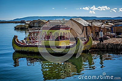 Weathered reed boats along the coast of Lake Titicaca in Puno, P Editorial Stock Photo